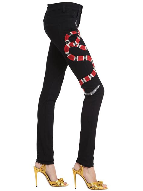 gucci embroidered jeans women's.